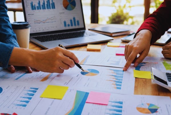 Marketing campaign planning team developing strategy and execution plans in a modern office