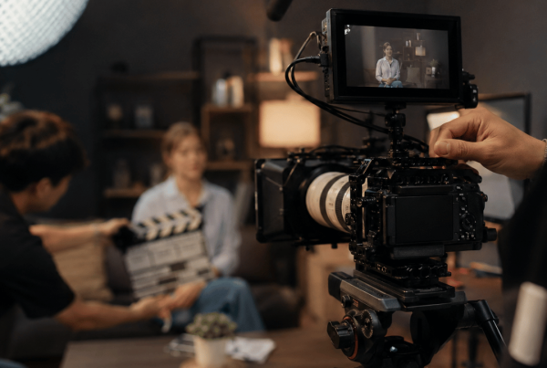 Professional video production setup with a camera filming an interview for a storytelling video.